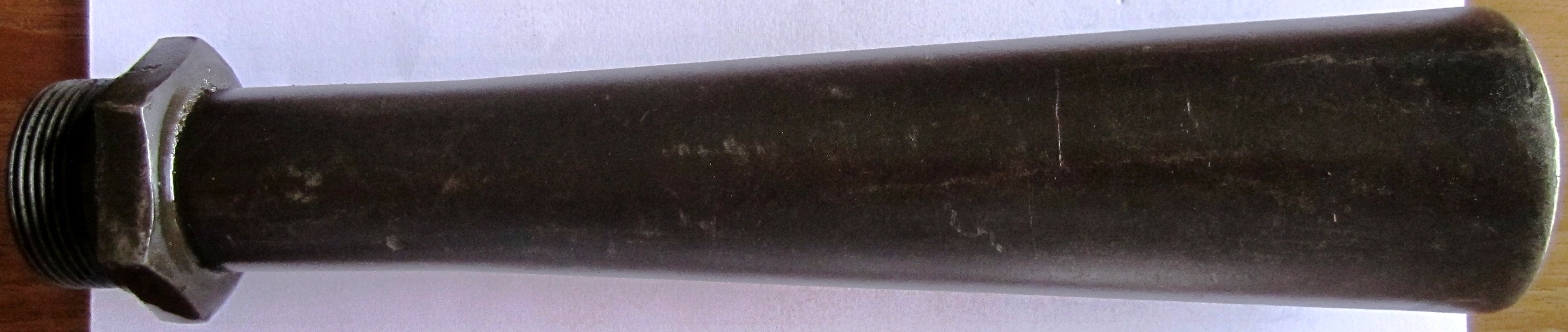 Photo MG13 flame suppressor in container